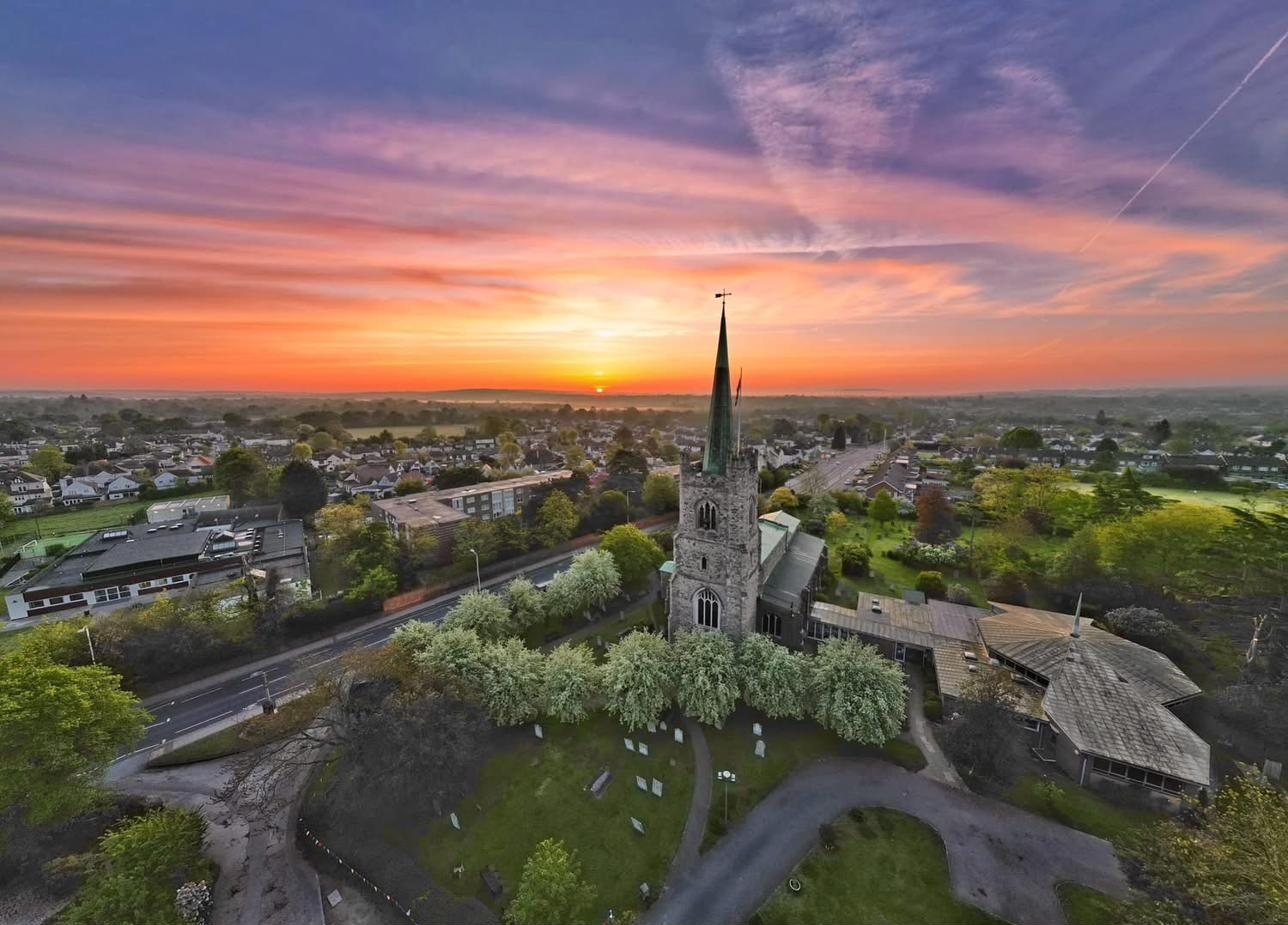 Aerial view of St Andrew\'s Church, Hornchurch at sunset